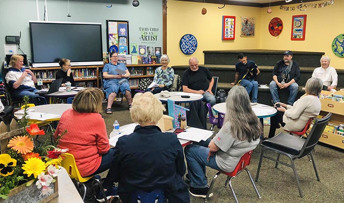 Page Paws Volunteer Meeting at a school, about 12 people in attendance