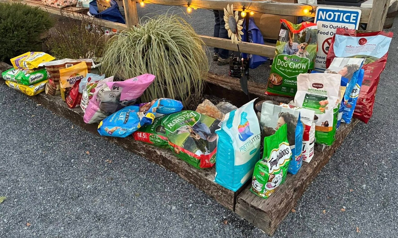 Dog and cat food donated to Page Paws at a community fundraising event